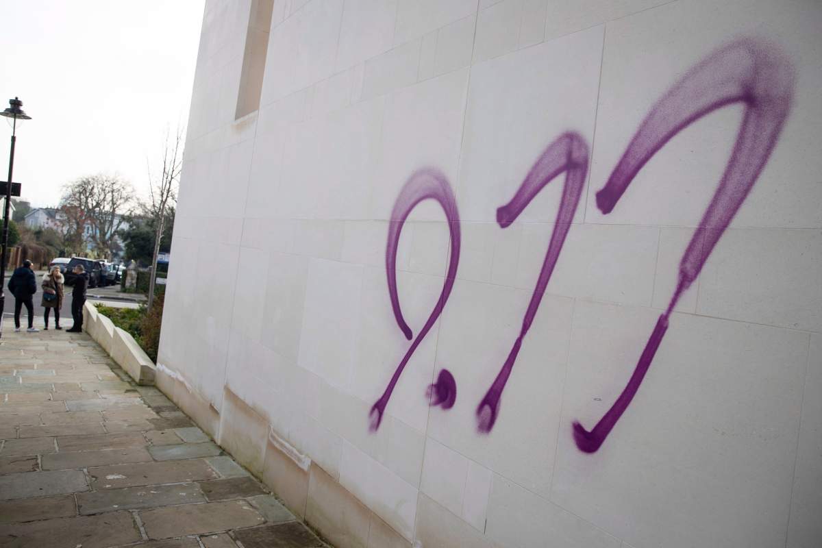 A view of anti-Semitic graffiti sprayed onto the outside of the South Hampstead Synagogue in North London, Sunday, Dec. 29, 2019. A synagogue and several shops in north London have been daubed with anti-Semitic graffiti during the Jewish festival of Hanukkah.