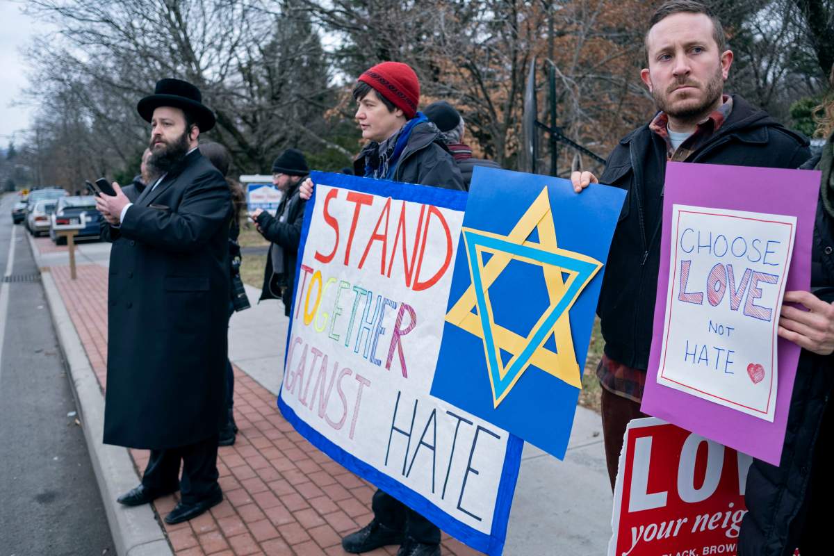 Neighbours gather to show their support of the community near a rabbi’s residence in Monsey, N.Y., Dec. 29, 2019, following a stabbing Saturday night during a Hanukkah celebration.