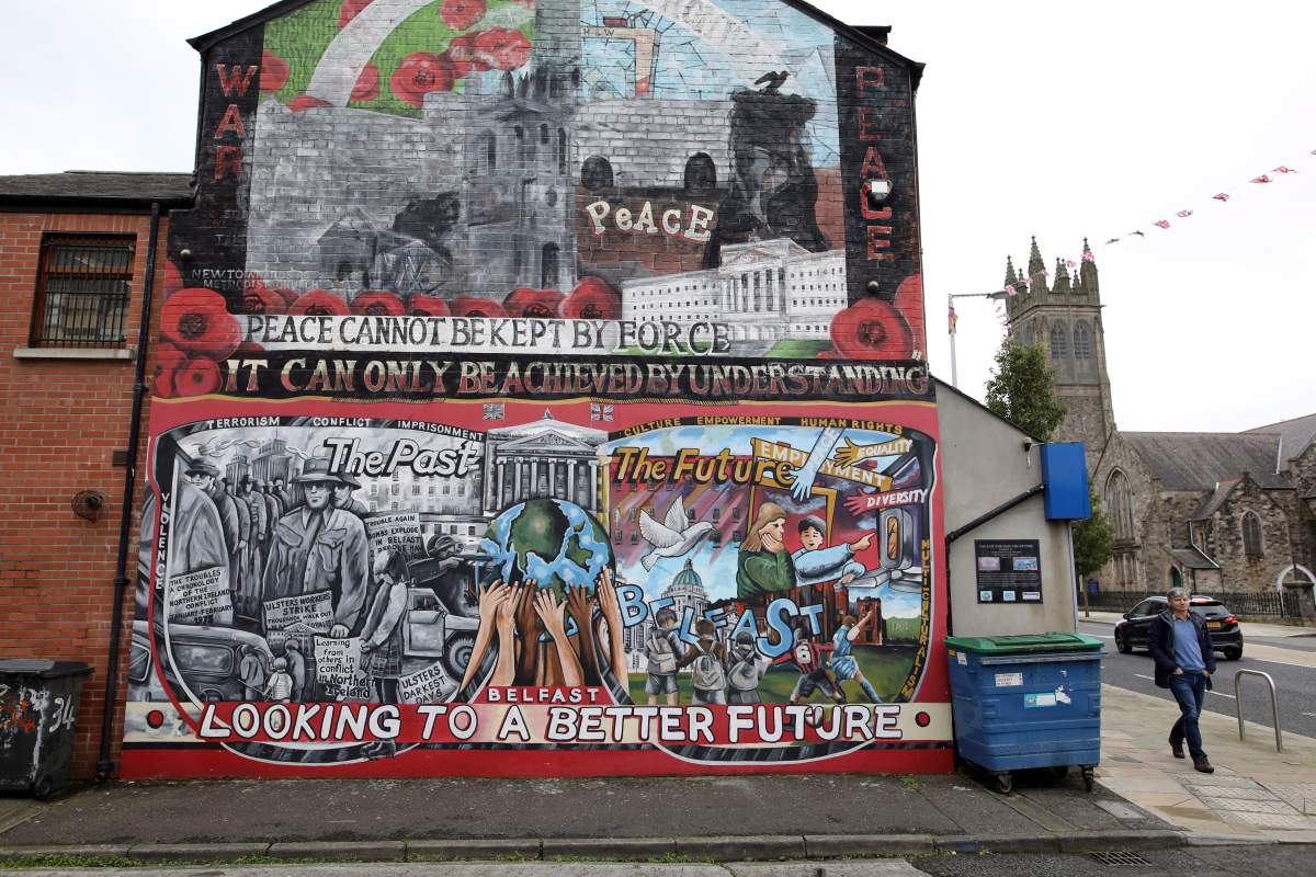 In this Oct. 15, 2019 photo showing a Loyalist mural painted on a wall in east Belfast, Northern Ireland. Rory Finnis was only 21 years old when he was killed in 1991 by the Irish Republican Army.