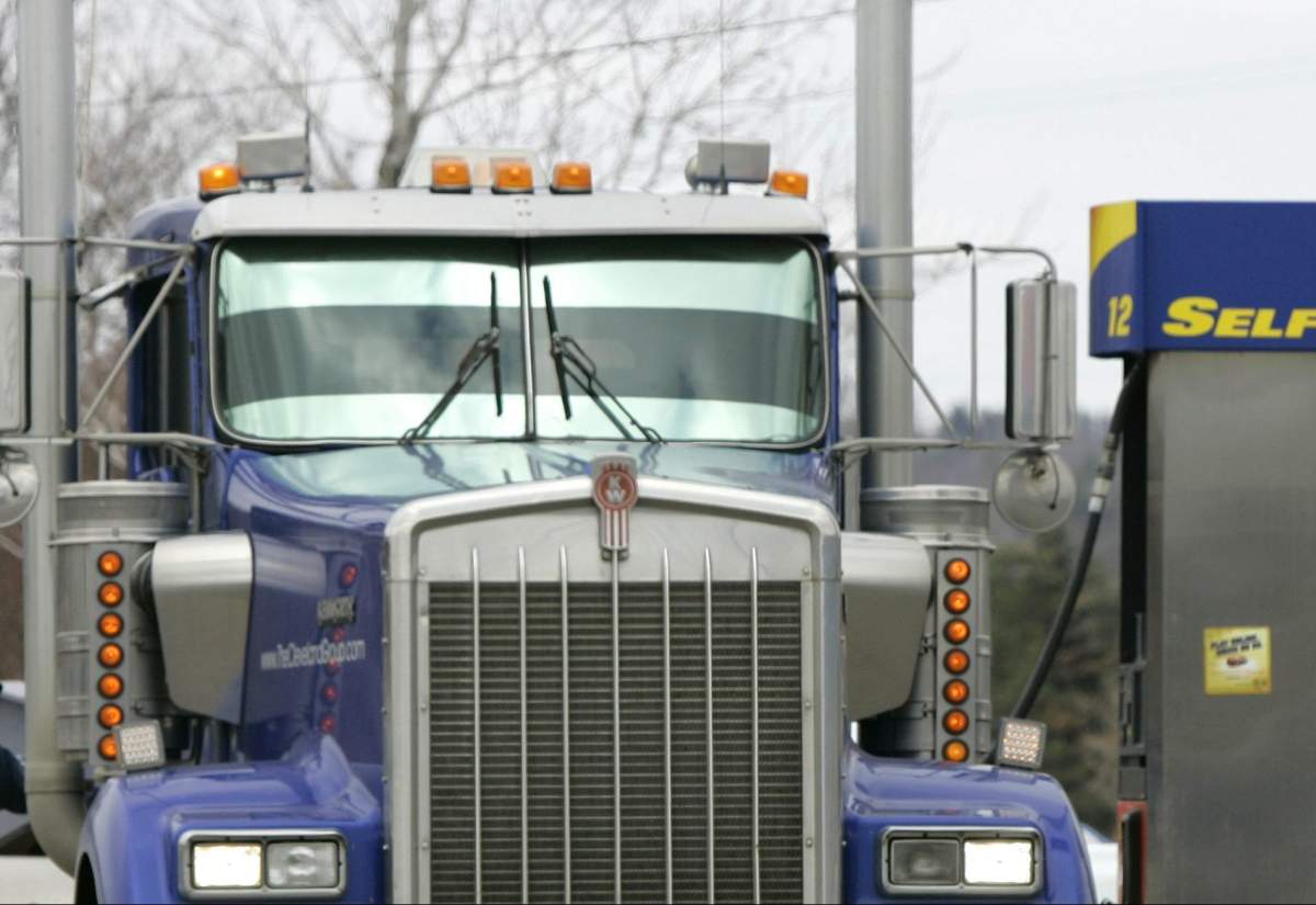 A driver fills his big rig with diesel fuel at a Sunoco gas station in Solon, Ohio on Monday, March 24, 2008. 