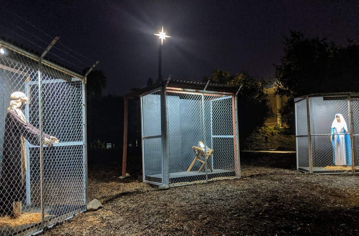 The Claremont United Methodist Church’s nativity scene this year features Mary, Joseph and baby Jesus separated in cages.