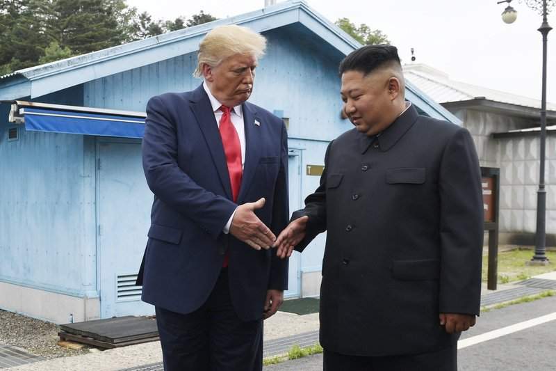 FILE - In this June 30, 2019, file photo, U.S. President Donald Trump meets with North Korean leader Kim Jong Un at the border village of Panmunjom in the Demilitarized Zone, South Korea. North Korea has again insulted President Donald Trump, calling him a “thoughtless and sneaky old man” after he tweeted that North Korean leader Kim Jong Un wouldn’t want to abandon a special relationship between the two leaders and affect the American presidential election by resuming hostile acts. 