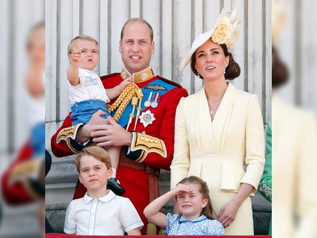 The Duke and Duchess of Cambridge and their kids Prince George, Princess Charlotte and Prince Louis stand on the Buckingham Palace balcony during Trooping the Colour in 2019.