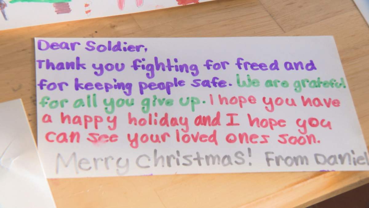 Students from Our Lady of Victories Catholic School in Edmonton make Christmas cards for Canadian Armed Forces.