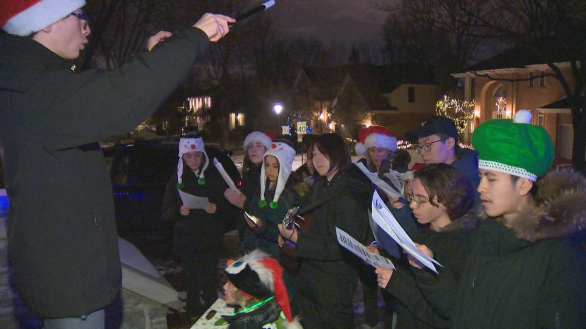 FACE students carolling to raise money for the Angels of Mercy charity.