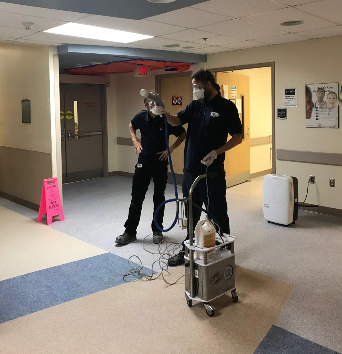 An electrostatic cleaner disinfects areas in the emergency department.