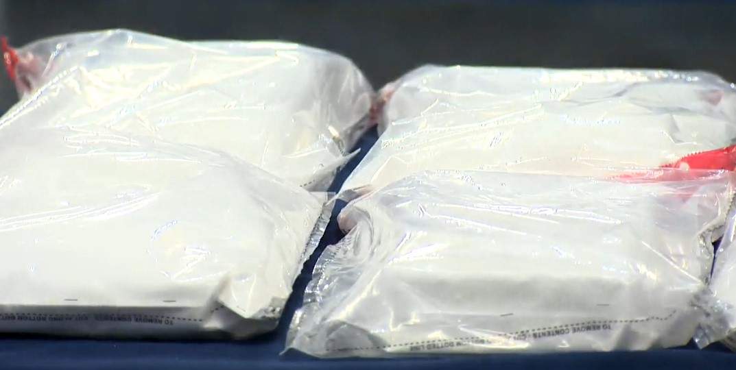 Police say they found 13 kilos of cocaine during the raids.