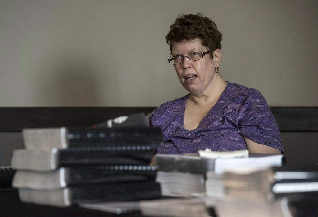 Beth MacLean is seen testifying at a human rights board of inquiry in 2018.
