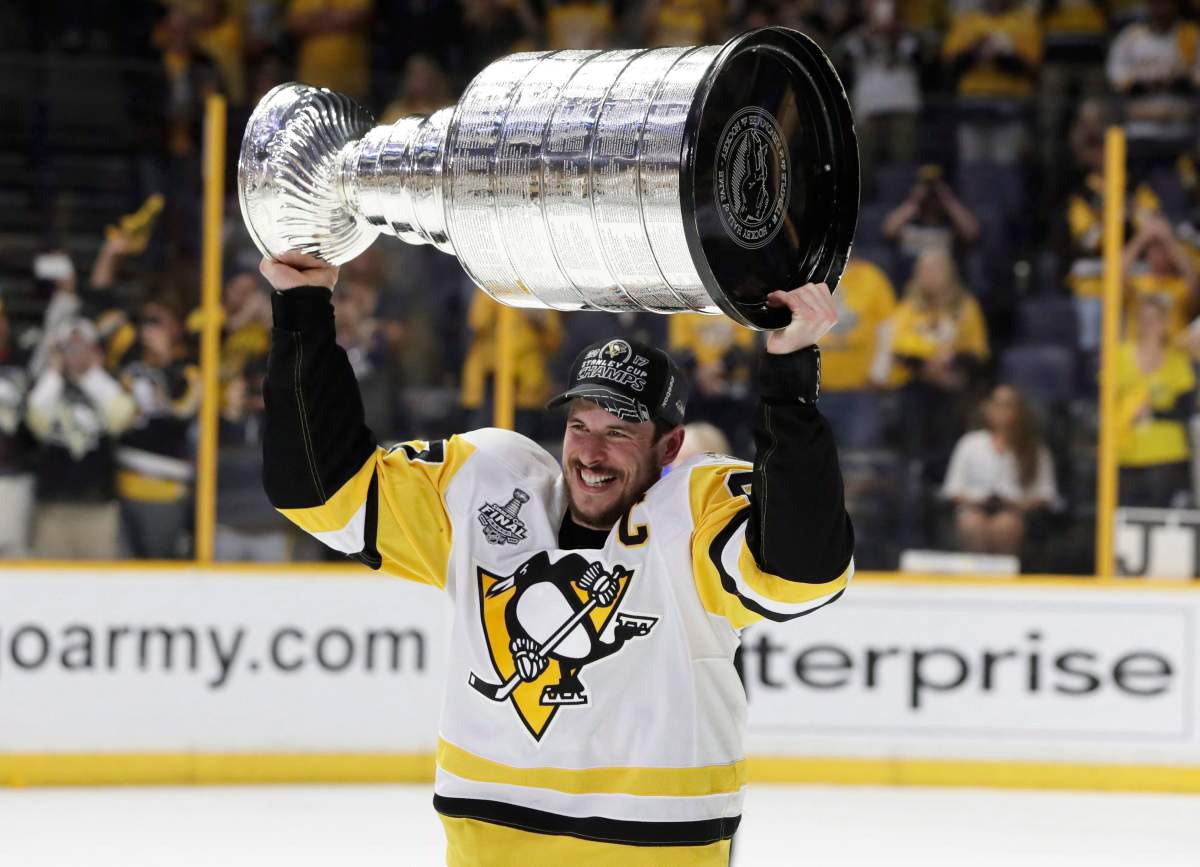 Pittsburgh Penguins' Sidney Crosby (87) celebrates with the Stanley Cup after defeating the Nashville Predators in Game 6 of the Stanley Cup Final in 2017.