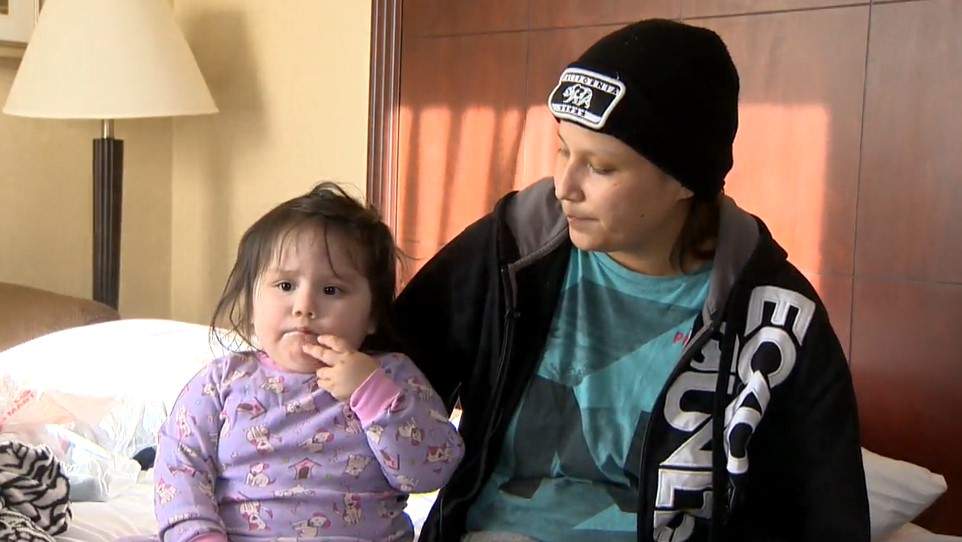 Chelsey Beardy and her daughter Winter, 2, fled the fire with only the clothes on their backs.