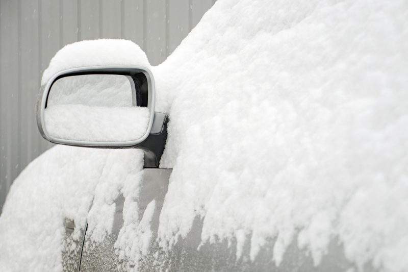 File photo - a snow-covered car. 