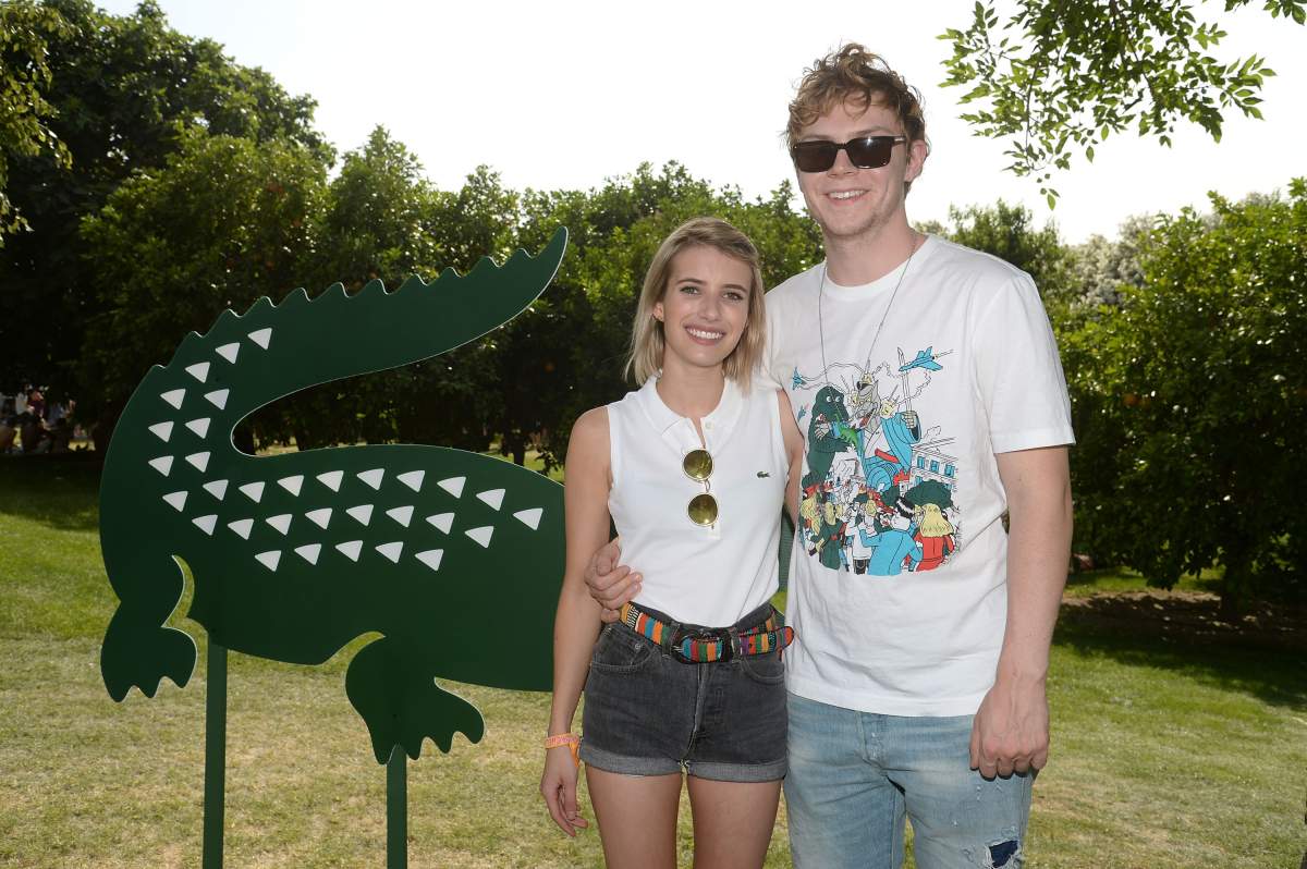 Actors Emma Roberts and Evan Peters attend Day 1 of the LACOSTE Beautiful Desert Pool Party on April 12, 2014 in Thermal, California. (Photo by Chris Weeks/Getty Images for LACOSTE)