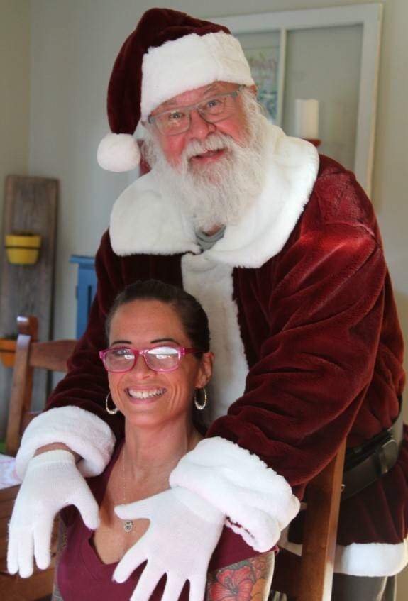 Gary Haupt, 69, poses with friend Michelle Prystay in his home.