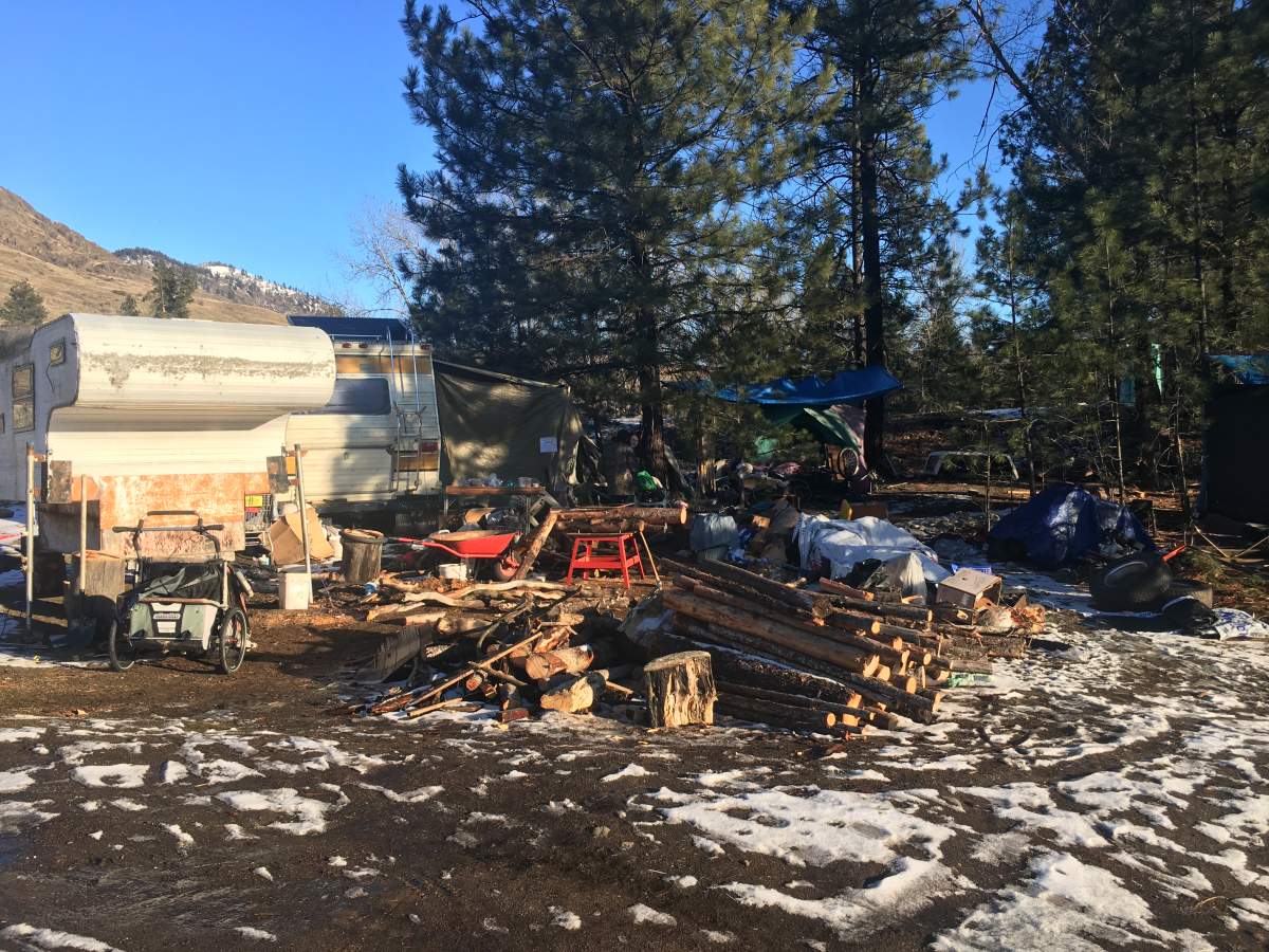 A man, who asked not to be identified, is living in this trailer and relying on a campfire to stay warm in sub-zero temperatures.