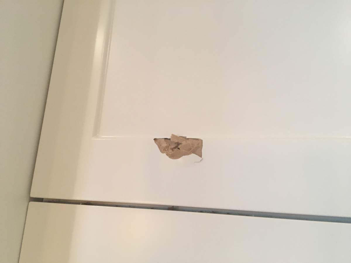 A bullet hole is seen in the kitchen cupboard of a home in northwest Calgary.