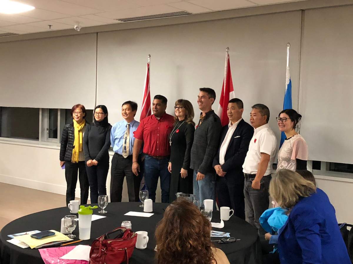 A picture taken at a Faith and Freedom Celebration in November 2018. Phyllis Tang is seen at the far right of this group shot.