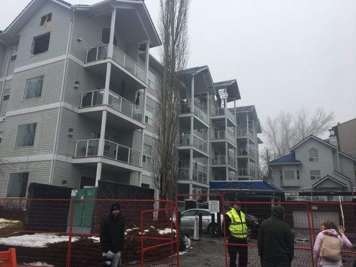 Residents view units at damaged Bankview building in Calgary on Saturday, Dec. 21, 2019.