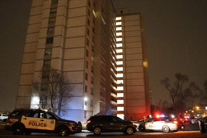 Police block off an entrance to a Jane Street apartment building.