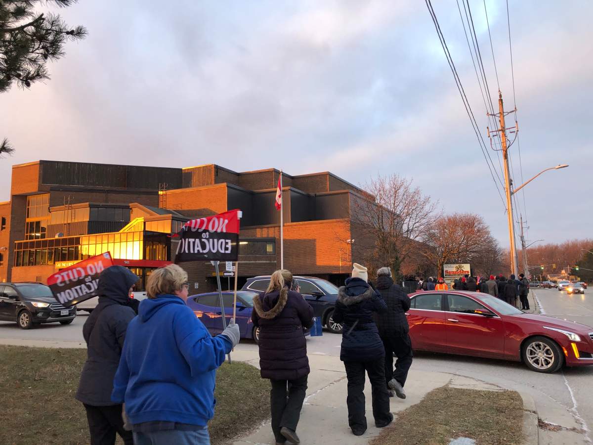 Members of the Ontario Secondary School Teachers' Federation gather for an information picket outside of Saunders Secondary School.