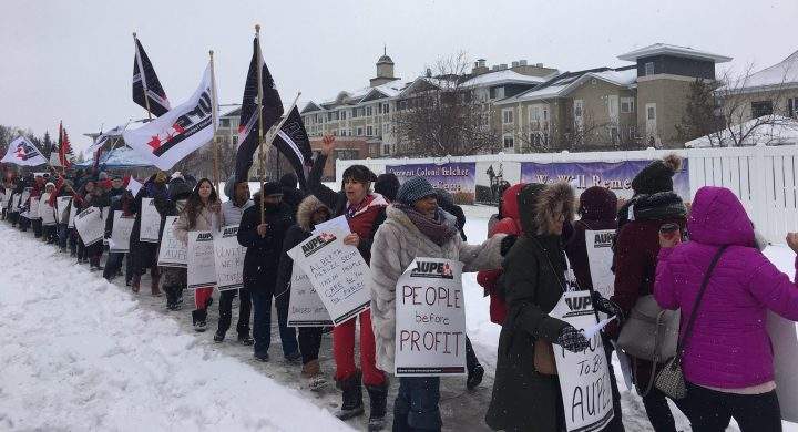 AUPE nurses rally in front of Carewest's Colonel Belcher seniors home to protest shift changes, which they say will negatively affect quality of life for nurses and residents.