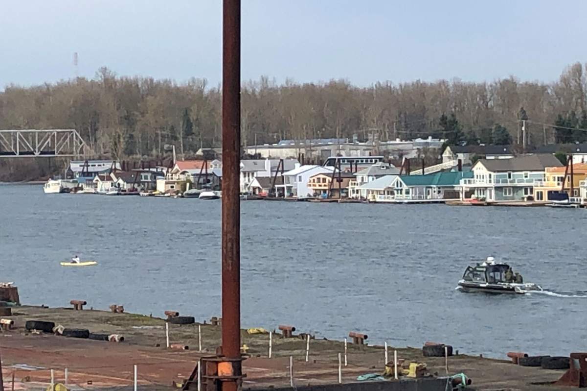 A wanted suspect is shown in a yellow kayak during a chase with police in Portland, Ore., on Dec. 18, 2019.