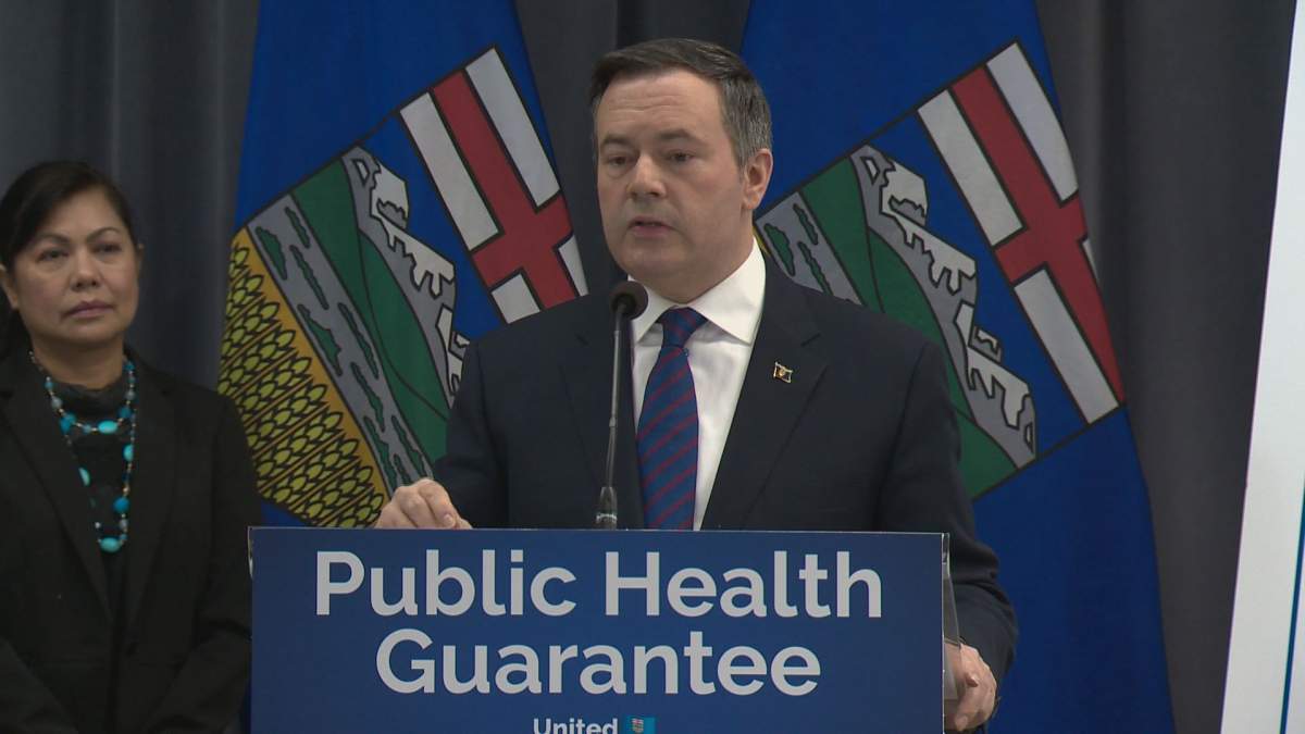 Jason Kenney speaking in February 2019, when he promised to maintain or increase health spending.