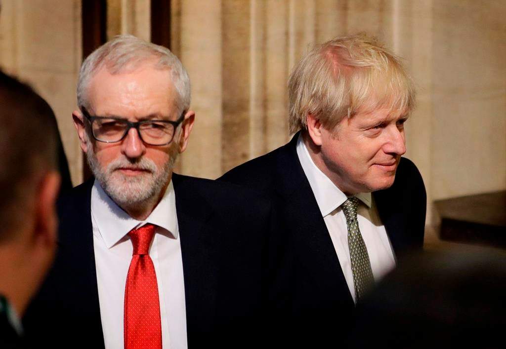 Britain’s Prime Minister Boris Johnson, right, and opposition Labour Party Leader Jeremy Corbyn, left, walk through the Commons Members Lobby after hearing the Queen’s speech in Parliament, in London, England, on Thursday, Dec. 19, 2019.