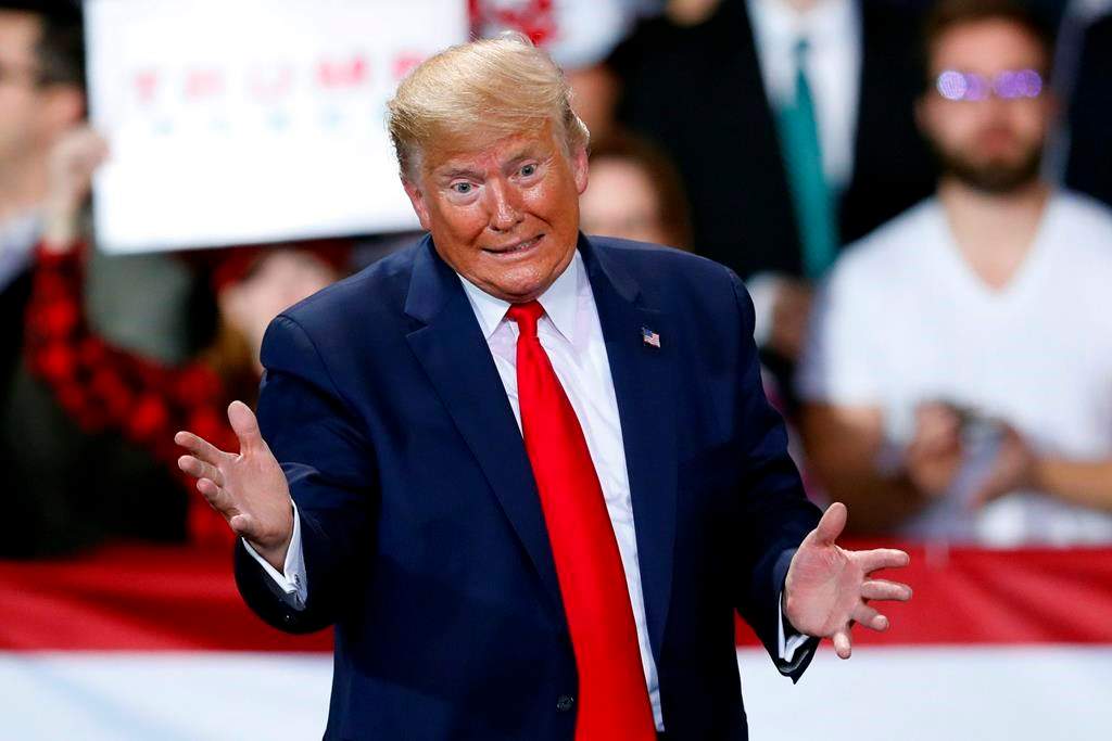 U.S. President Donald Trump speaks at a campaign rally in Battle Creek, Mich., on Wednesday, Dec. 18, 2019. (AP Photo/Paul Sancya)