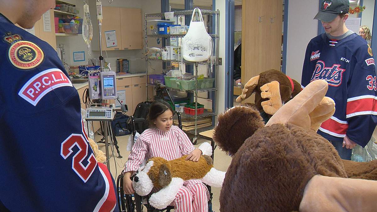 Regina Pats at the RGH handing out stuffed animals collected at Teddy Bear Toss Night on Saturday.