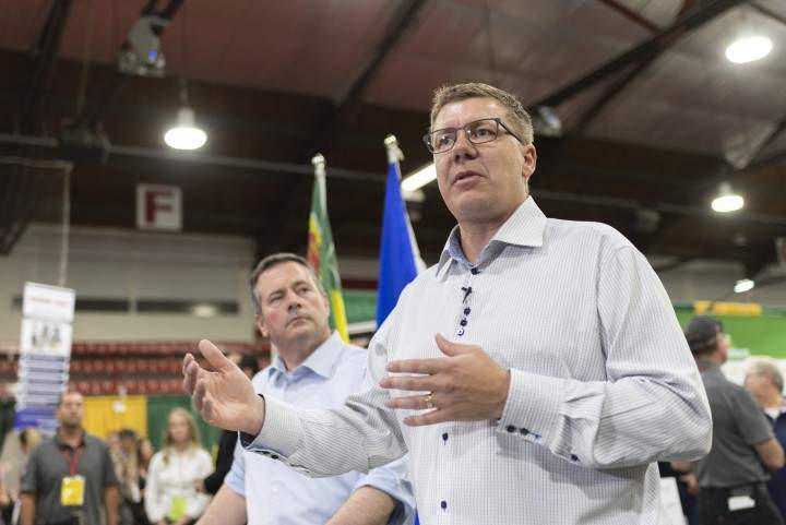 Alberta Premier Jason Kenney, left, and Saskatchewan Premier Scott Moe, right, speak during a press conference at the Saskatchewan Oil & Gas Show in Weyburn, Sask. on Wednesday June 5, 2019. 