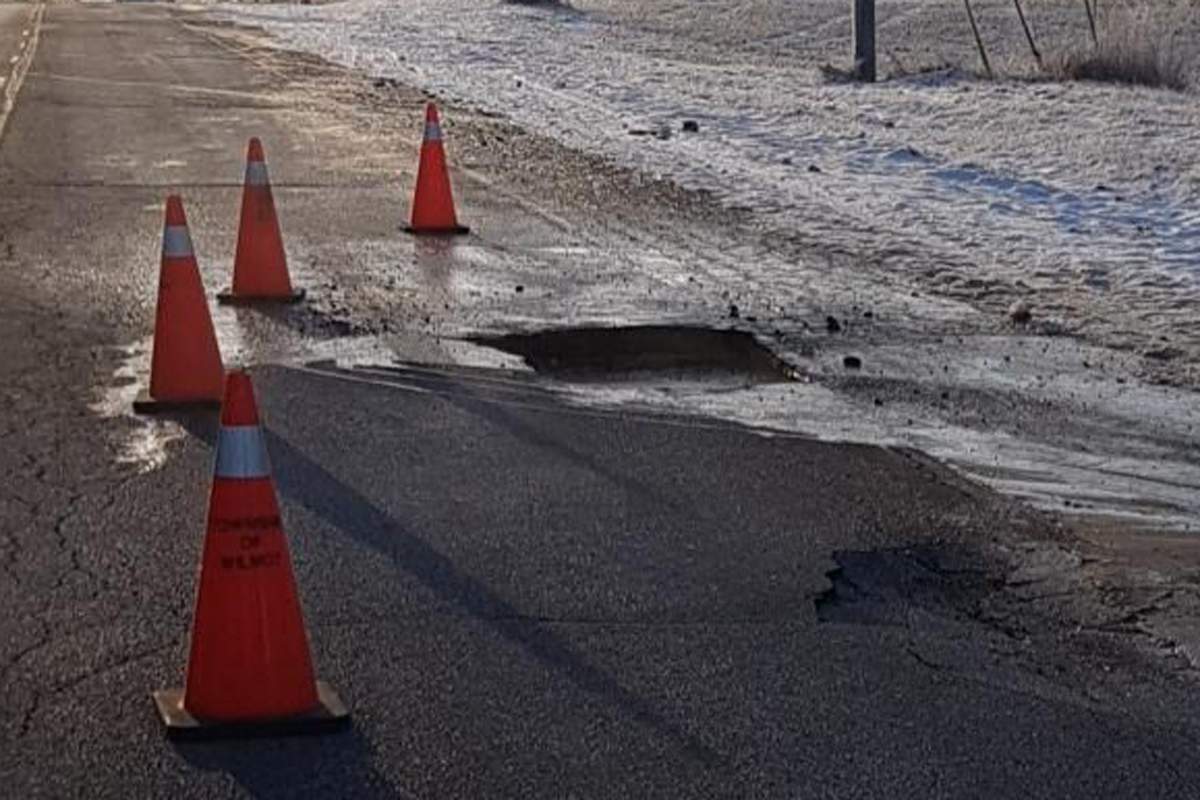 Six cars were damaged passing over this sinkhole, according to police.