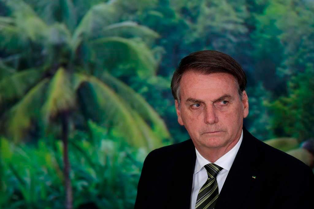 FILE - In this Oct. 1, 2019 file photo, President Jair Bolsonaro attends a ceremony to launch an agro program at the Planalto presidential palace in Brasilia, Brazil.