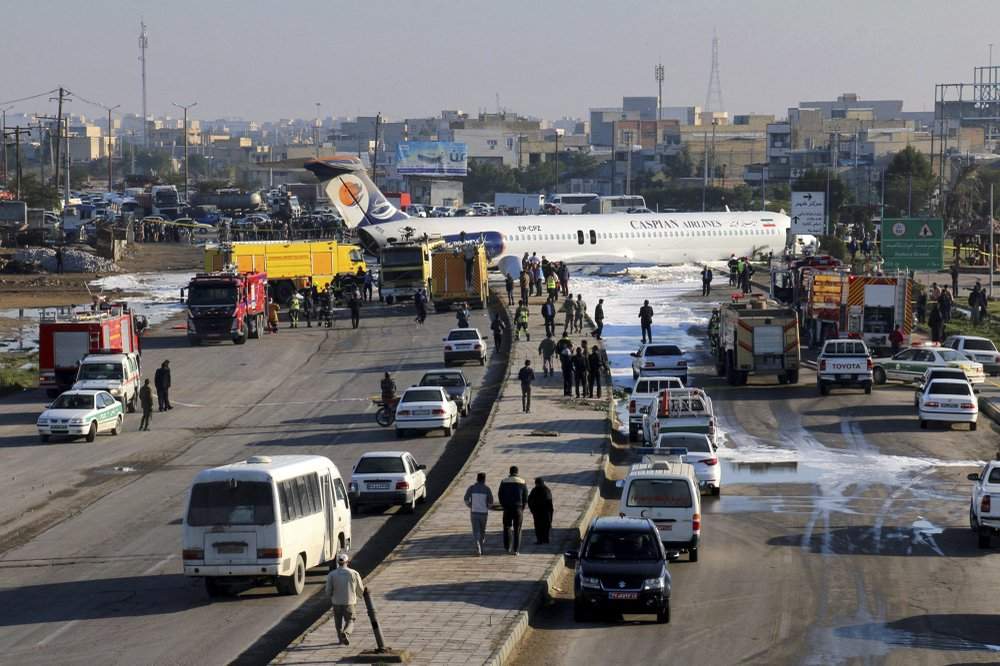 An Iranian passenger plane sits on a road outside Mahshahr airport after skidding off the runway, in southwestern city of Mahshahr, Iran, Monday, Jan. 27, 2020. An Iranian passenger airliner carrying some 150 passengers skidded off the runway and into a street next to the airport in the southern city of Mahshahr on Monday, after apparently losing its landing gear in a hard landing. 
