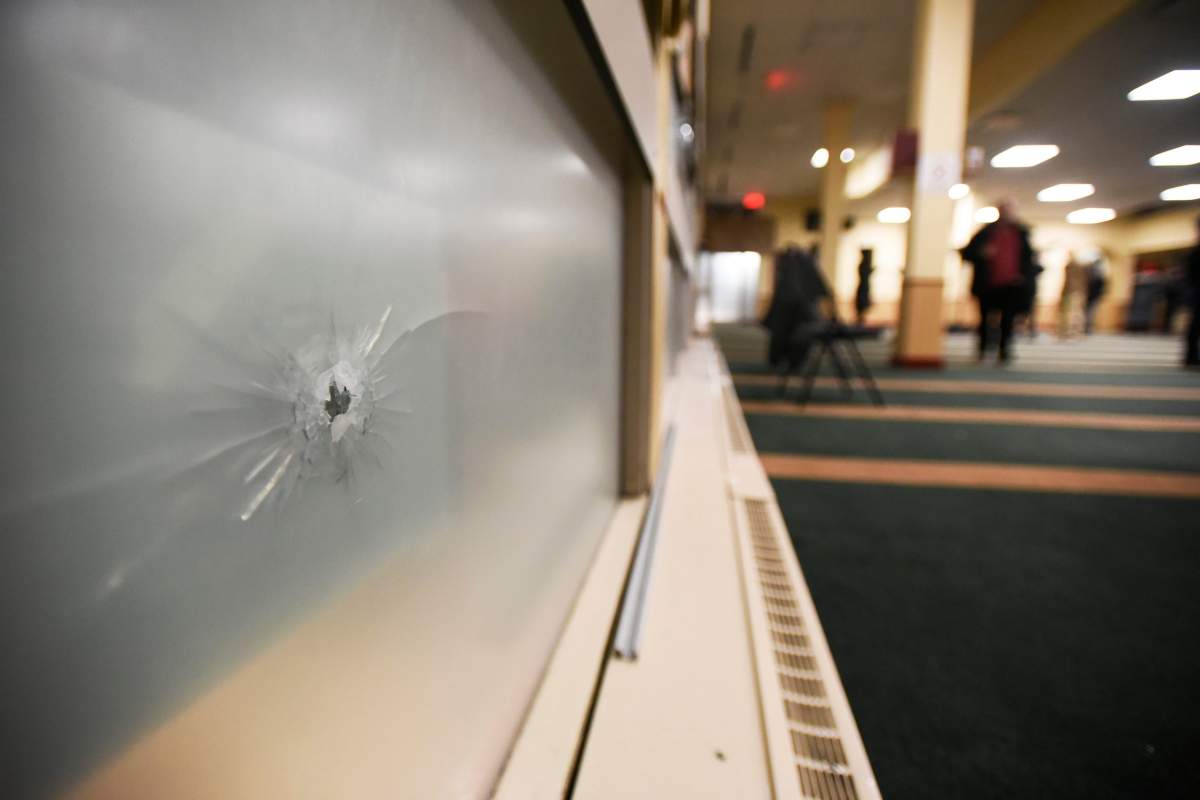 A bullet hole in the front window of the Centre Culturel Islamique de Quebec is photographed on Jan. 31, 2017.  (Fred Lum/The Globe and Mail)