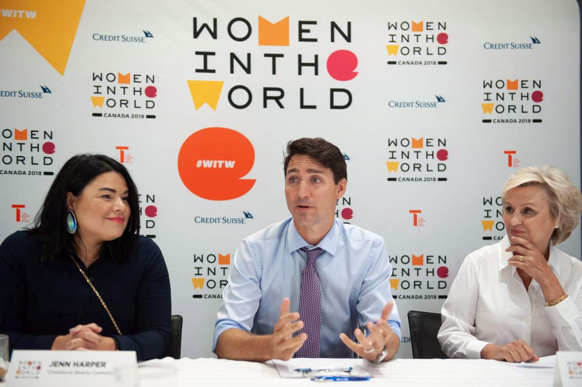 Prime Minister Justin Trudeau participates in a roundtable discussion along with Jenn Harper, left, founder of Cheekbone Beauty Cosmetics INC and Tina Brown, founder and CEO of Women in the World Media, LLC, at the Women in the World Summit in Toronto on Monday, September 10, 2018.