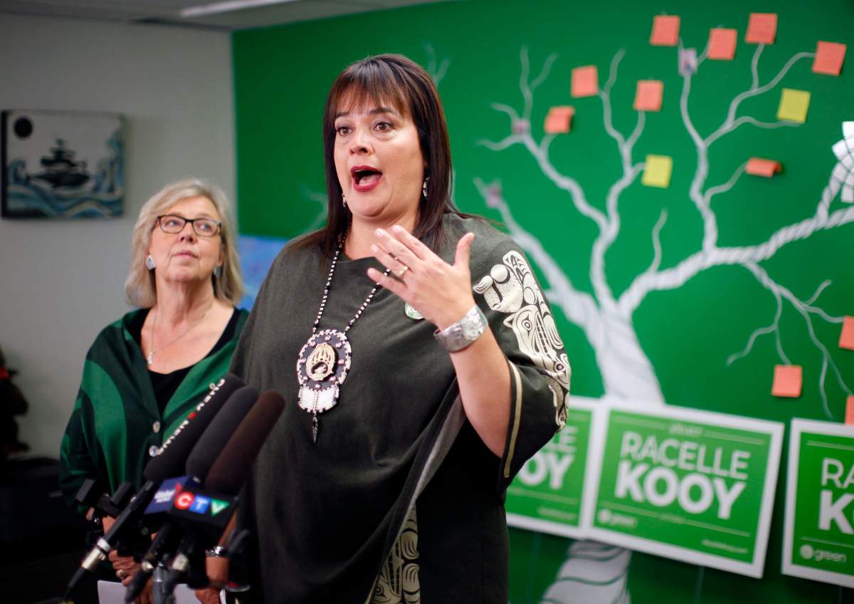 Green Party Leader Elizabeth May looks on as she\’s joined by candidate Racelle Kooy during an announcement that the Green government will expand the single-payer medicare model to include pharmacare for everyone during a press conference while in Victoria, Wednesday, Oct. 16, 2019.