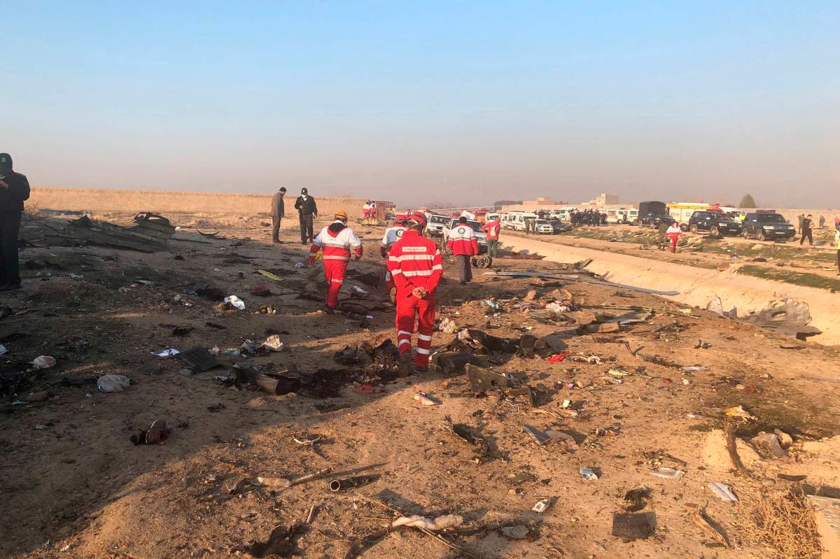 Debris is seen from a plane crash on the outskirts of Tehran, Iran, Wednesday, Jan. 8, 2019. A Ukrainian airplane carrying at least 170 people crashed on Wednesday shortly after takeoff from Tehrans main airport, killing all onboard, state TV reported.