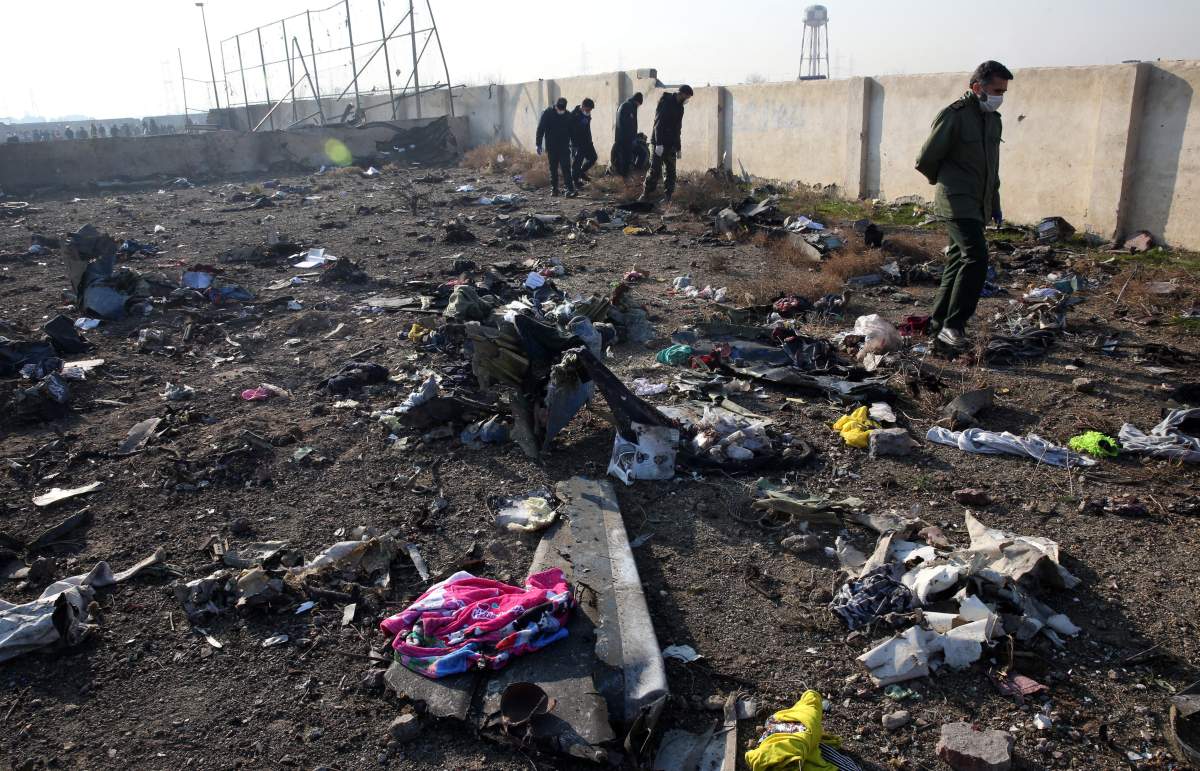 A view of victims possessions around the wreckage after an Ukraine International Airlines Boeing 737-800 carrying 176 people crashed near Imam Khomeini Airport in Tehran, killing everyone on board, in Shahriar, Iran, 08 January 2020.