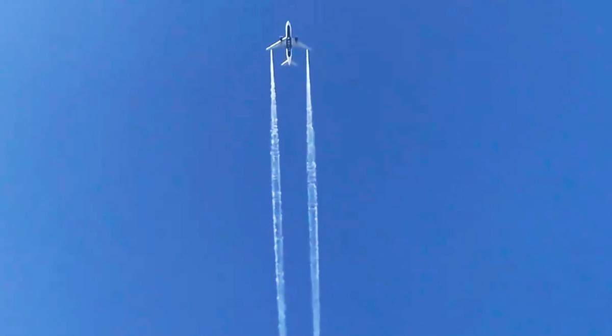 In this photo from video, Delta Air Lines Flight 89 to Shanghai, China dumps fuel over Los Angeles before returning to Los Angeles International Airport for an emergency landing Jan. 14, 2020.