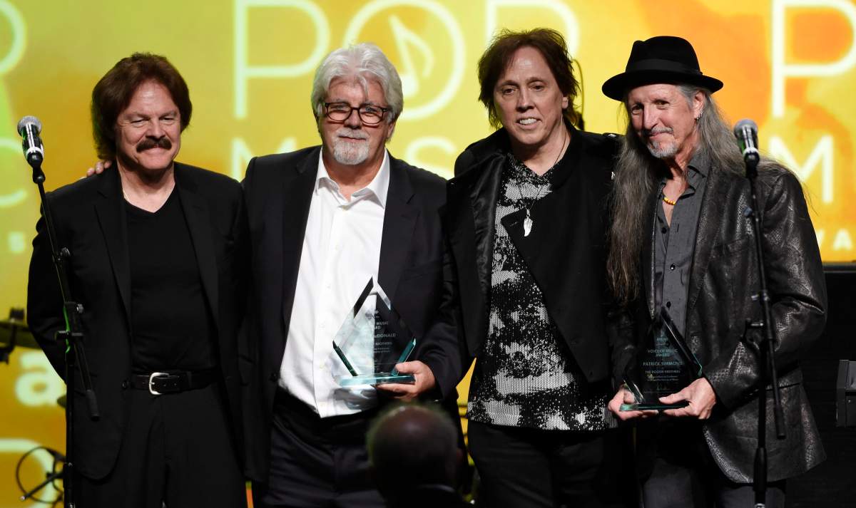 This April 29, 2015 file photo shows from left, Tom Johnston, Michael McDonald, John McFee and Pat Simmons of the Doobie Brothers after receiving the ASCAP Voice of Music Award.