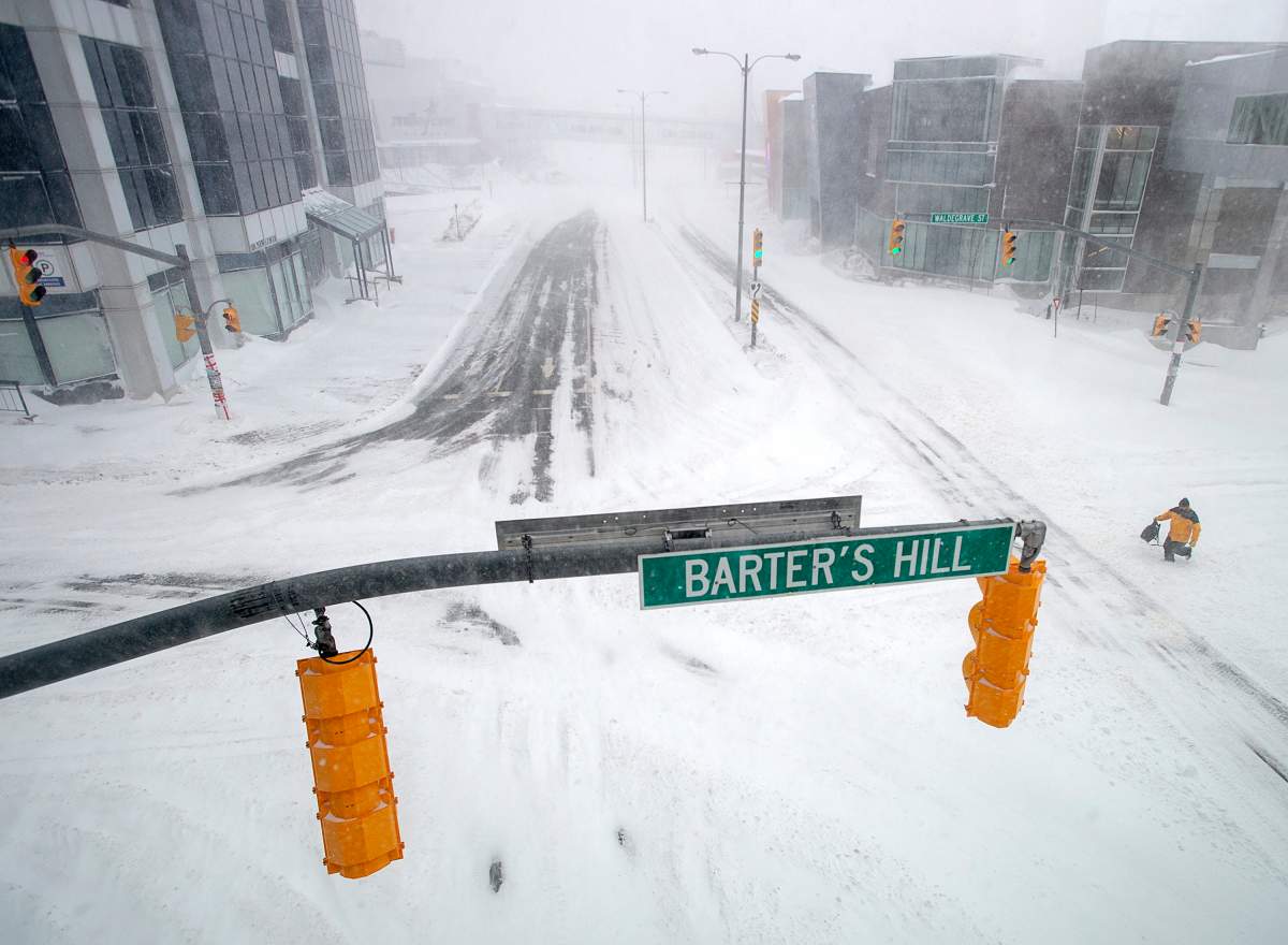 A pedestrian braves extreme conditions as he walks in St. John’s on Friday, Jan. 17, 2020. The City of St. John’s has declared a state of emergency, ordering businesses closed and vehicles off the roads as blizzard conditions descend on the Newfoundland and Labrador capital. THE CANADIAN PRESS/Andrew Vaughan