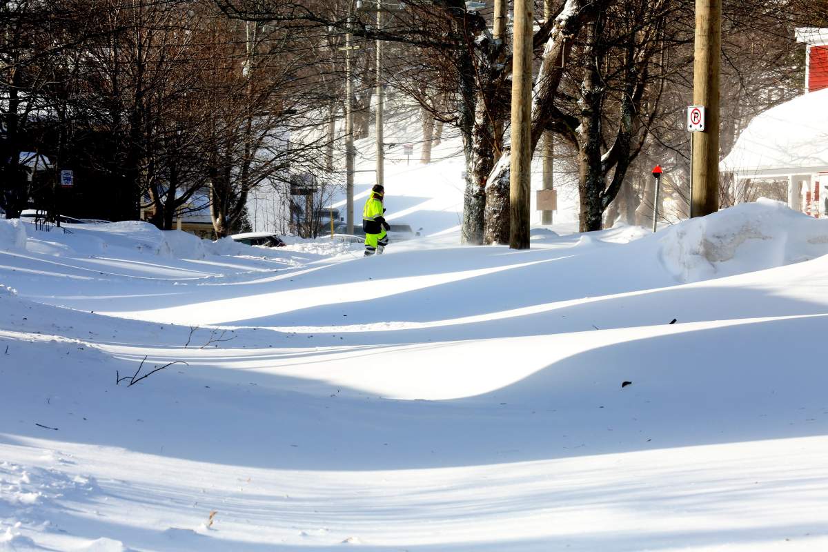 A resident snowshoes in the middle of a major street, in downtown St. John’s, N.L. on Saturday, Jan. 18, 2020. The state of emergency ordered by the City of St. John’s is still in place, leaving businesses closed and vehicles off the roads in the aftermath of the major winter storm that hit the Newfoundland and Labrador capital. THE CANADIAN PRESS/Paul Daly