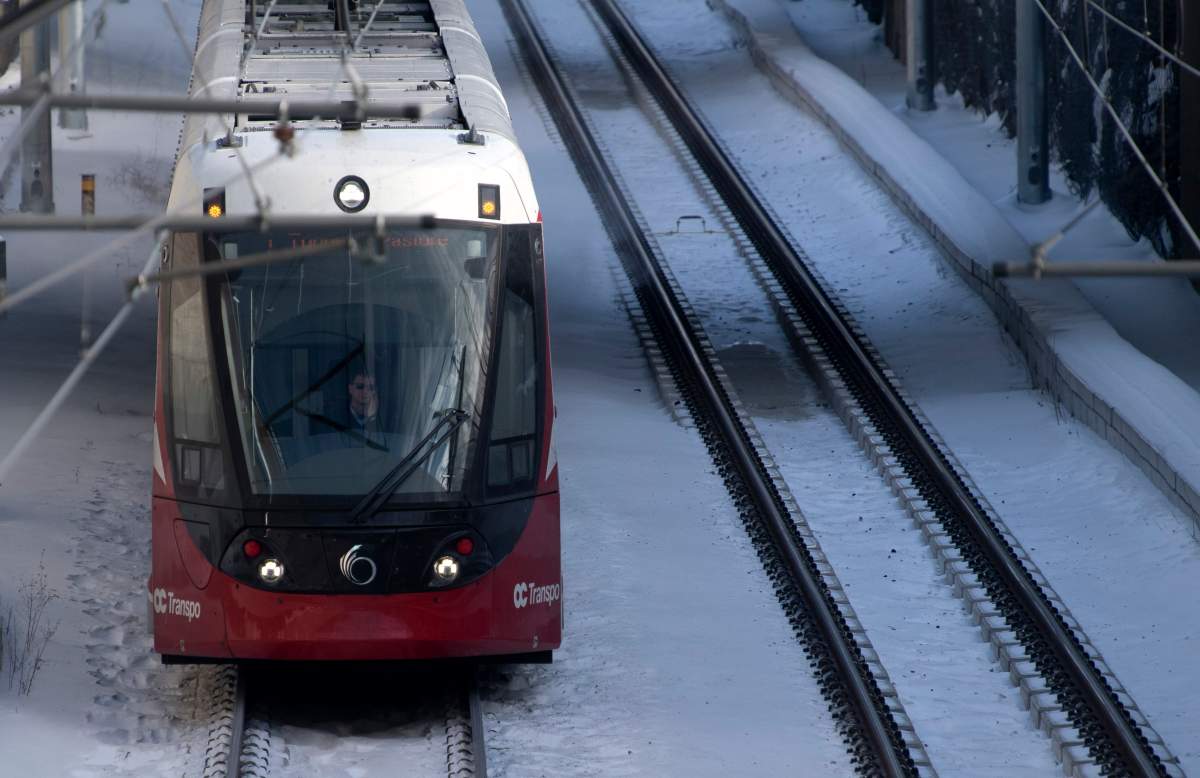 An OC Transpo light-rail train is seen heading out of downtown Ottawa on Tuesday, Jan. 21, 2020.
