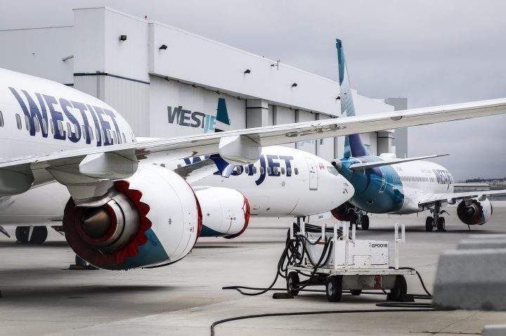 Grounded WestJet Boeing 737 Max aircraft are shown at the airline's facilities in Calgary, Alta., Tuesday, May 7, 2019. WestJet Airlines Ltd. says is removing Boeing's grounded 737 Max jet from flight schedules through June 24 following the manufacturer's latest guidance about regulatory approval for the plane to fly again. 