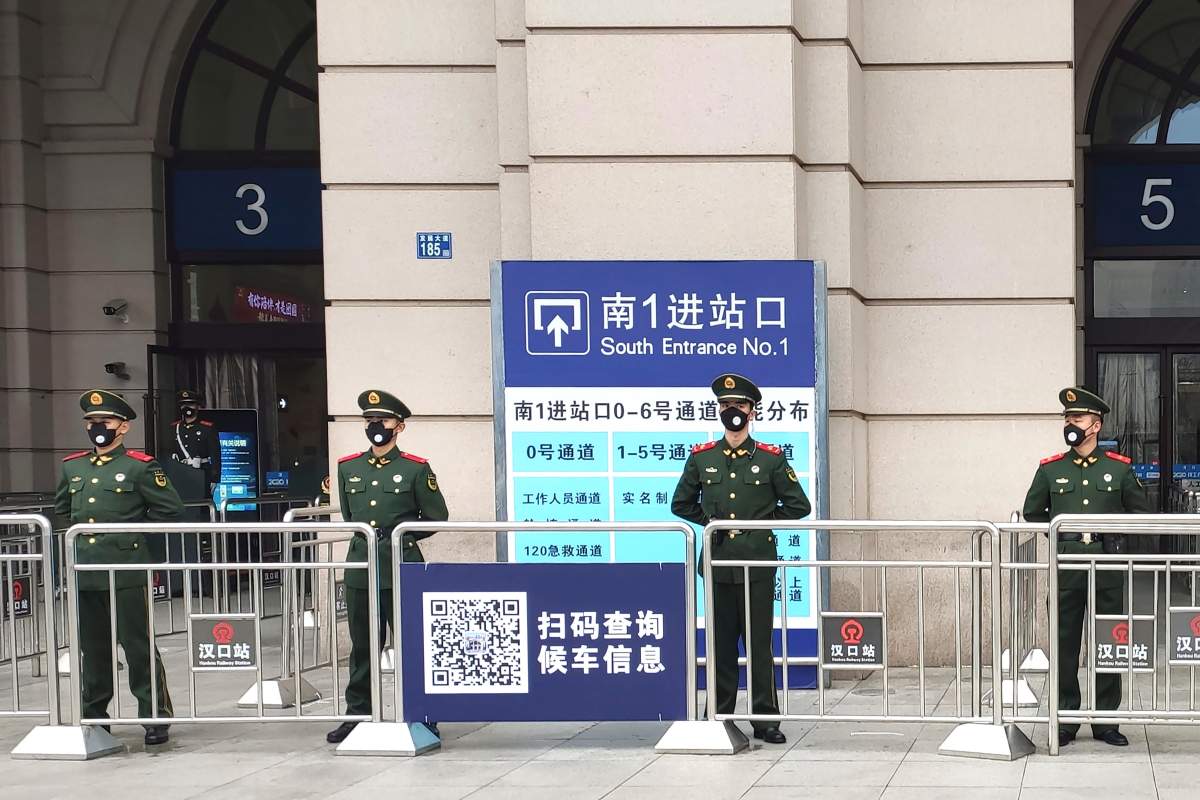 Paramilitary police stand guard at an entrance to the closed Hankou Railway Station in Wuhan in central China’s Hubei Province, Thursday, Jan. 23, 2020.
