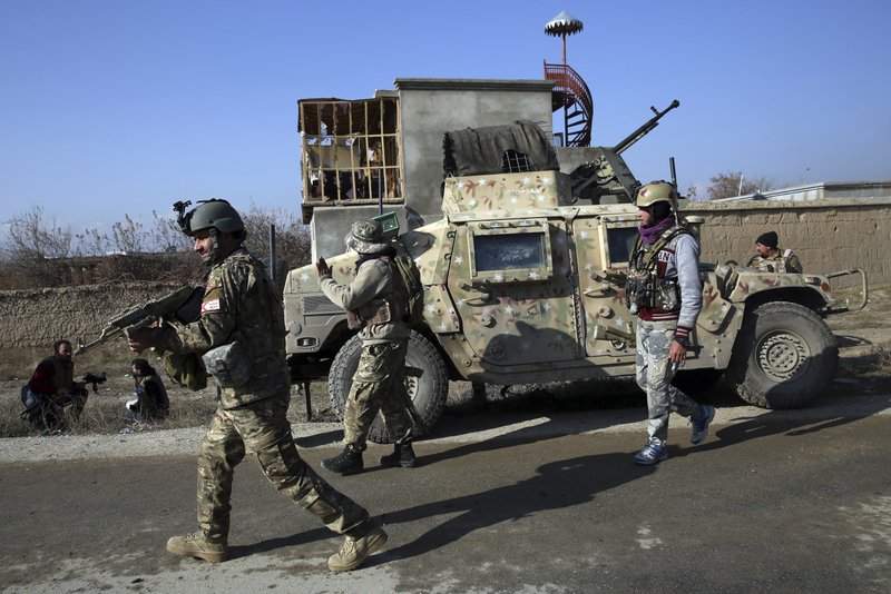 Security personnel arrive near the site of an attack near the Bagram Air Base In Parwan province of Kabul, Afghanistan, Wednesday, Dec. 11, 2019. A powerful suicide bombing Wednesday targeted an under-construction medical facility near the Bagram Air Base, the main American base north of the capital Kabul, the U.S. military said. 