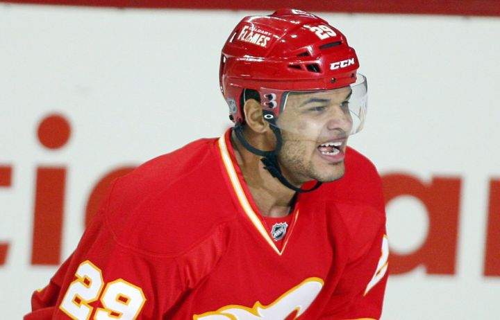 Calgary Flames' Akim Aliu, from Nigeria, celebrates his first NHL goal during first period NHL hockey action against the Anaheim Ducks in Calgary, Alta., Saturday, April 7, 2012. 