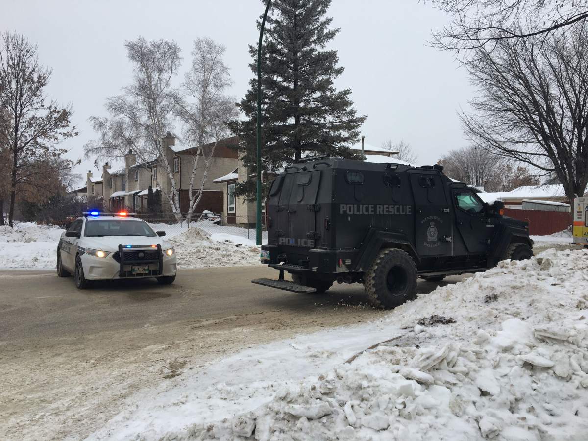 A WPS cruiser and the armoured vehicle block part of Kinver Avenue as police investigate at a home nearby.