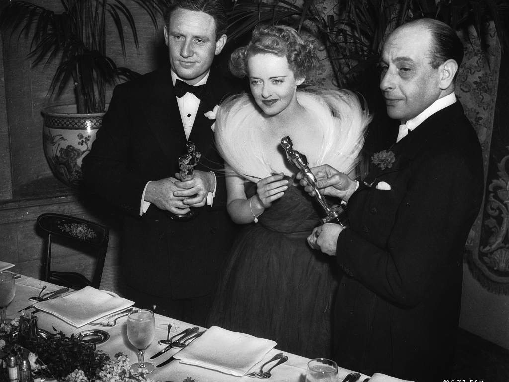 American film stars Spencer Tracy and Bette Davis accept their statuettes at the 1939 Academy Awards. They won the Best Actor and Best Actress Oscars for ‘Boys Town’ and ‘Jezebel’ respectively.