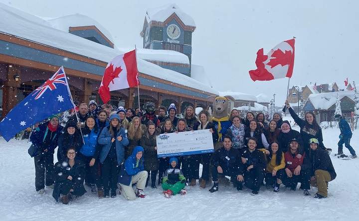 Fundraisers gather around a cheque worth $8,000 at Big White Ski Resort. The money was donated to Australia’s Country Fire Authority to help combat wildfires.